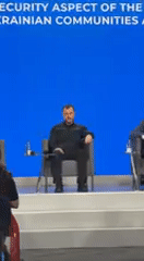 Conference panel discussion held in Kyiv featuring bearded speaker