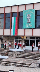 Traditional folk dance performance captured in Bulgarian hillside town