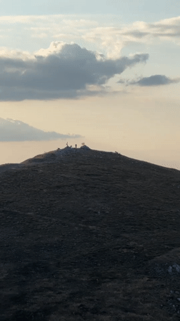 Gathering at Buzludzha monument, Shipka peaks at sunset