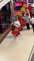 Costumed procession walks through commercial space in Peru