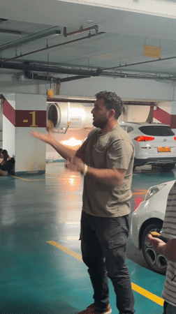 Beachgoers play footvolley on Tel Aviv sand