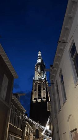 Illuminated Gothic Tower Photographed During Twilight in Amersfoort