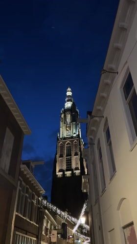 Illuminated Gothic Tower Photographed During Twilight in Amersfoort