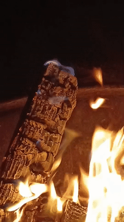 Fireplace logs burning bright in Viadana on a July evening