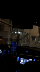 Driver navigates Yerevan streets at night using smartphone GPS