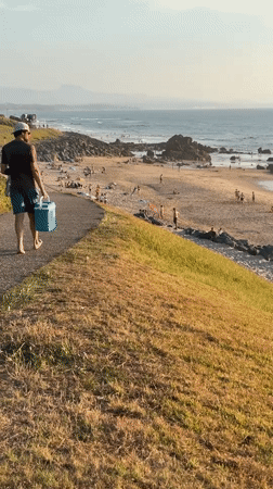 Busy summer evening on Biarritz's beaches at golden hour