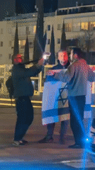 Nighttime demonstration draws crowds to central Tel Aviv locations
