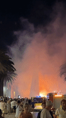 Fireworks and drumming fill Salou's promenade on a summer night