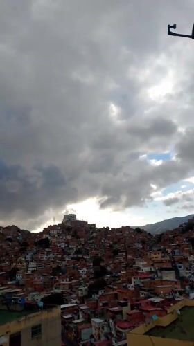 Caracas residents document evening life under dramatic stormy skies