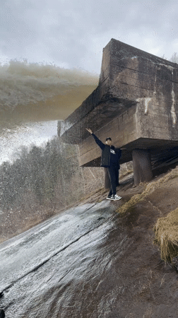 Visitors gather at waterfall site near Chaikovsky for sightseeing, picnic