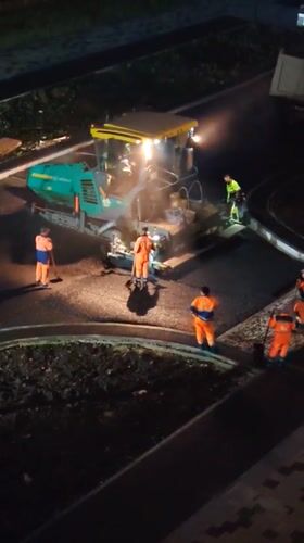 Night road construction operations in Yekaterinburg