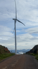 Wind turbines spotted across tea plantation hills in Vietnam