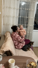 Family cooking and childcare moments captured in Sochi home