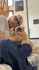 Woman enjoys quiet morning with Pomeranian in Chambœuf