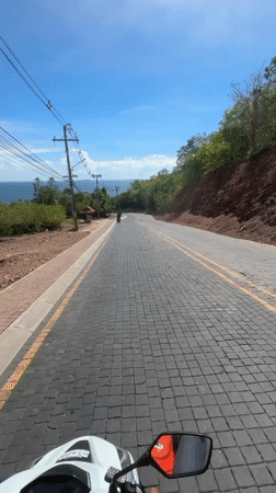Morning motorcycle ride documented on Pattaya's brick-paved streets