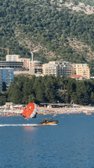 Parasailing behind a motorboat off the Montenegrin coast.