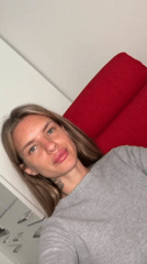 Woman rests in Berlin apartment, captured by witnesses
