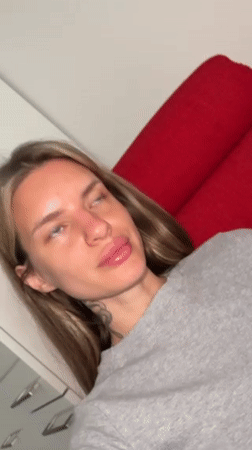 Woman rests in Berlin apartment, captured by witnesses