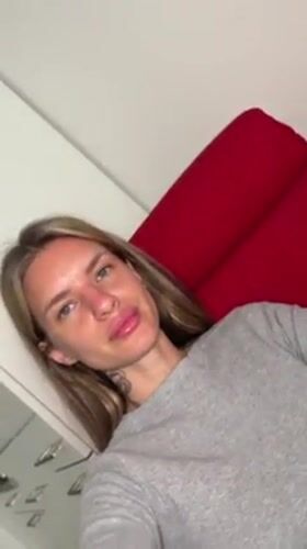 Woman rests in Berlin apartment, captured by witnesses