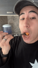 Man enjoys cantaloupe snack in Mexican kitchen