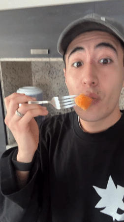 Man enjoys cantaloupe snack in Mexican kitchen