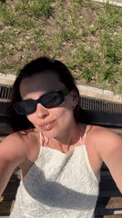 Woman enjoys sunny morning at Chaikovsky public recreation area