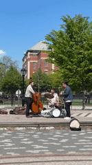 Three-piece band performs outdoor street music in New York
