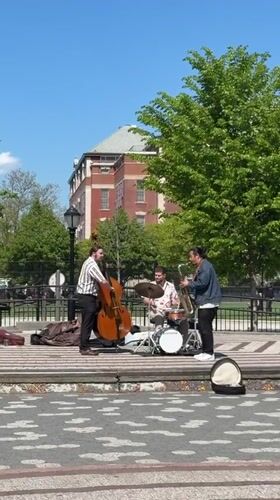 Three-piece band performs outdoor street music in New York