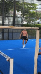 Two men play paddle tennis in Mengwi, Indonesia