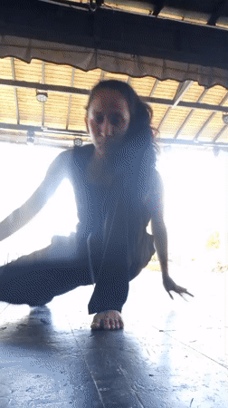 Woman performs yoga poses at outdoor pavilion in Porlamar