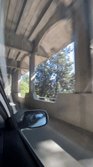 Vehicle travels under concrete bridge in Budva, Montenegro