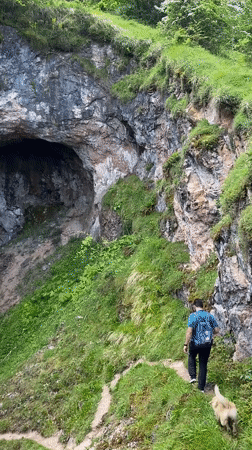 Tourists explore Pozu Funeres sinkholes in mountainous Riosa, Spain