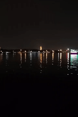 Hyderabad lake captures city skyline reflections in nighttime video