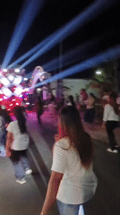 Truck sound system and dancing crowds at a Pojok street festival