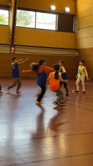 Children play organized game in La Fouillouse gymnasium