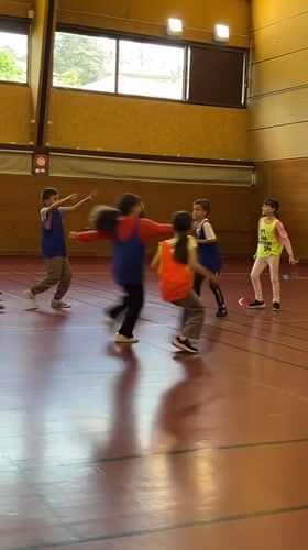 Children play organized game in La Fouillouse gymnasium