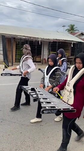 Drum corps practice and penalty kicks at a community event