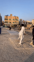 Cricket match played on dirt field in Quetta, Pakistan