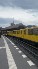 U3 train arrives at Berlin station, passengers board