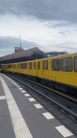 U3 train arrives at Berlin station, passengers board