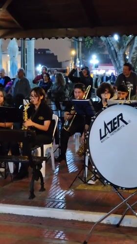 Young musicians perform nighttime outdoor concert in Barranco, Peru