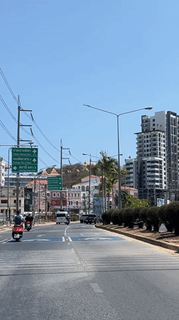 Morning drive captured on sunny Pattaya street