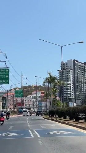 Morning drive captured on sunny Pattaya street