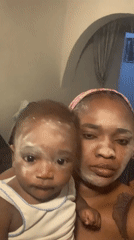 Mother and baby share facial treatment routine in Nigeria