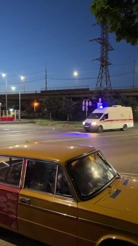 Emergency vehicles respond in Krasnodar street scene at dusk