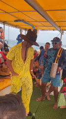 Two men dance on boat in Punta de Piedras
