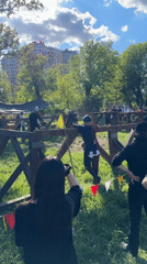 Medieval reenactment combat draws spectators at park Renaissance fair