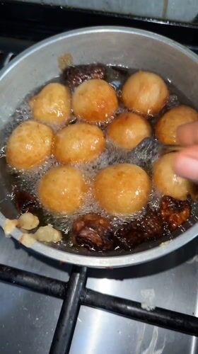 Morning cooking scene documented in Sabon Tasha, Nigeria