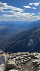 Hiker documents mountain views from peak near Arshan, Russia