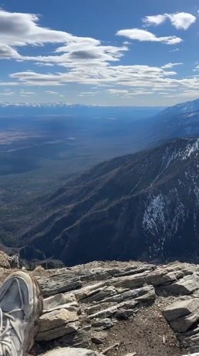 Hiker documents mountain views from peak near Arshan, Russia
